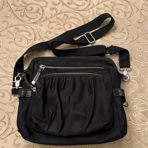 MZ Wallace black nylon messenger bag. Silver hardware many sections & mini pouch
